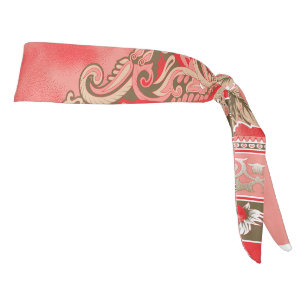 a red scarf with flowers on it tie headband
