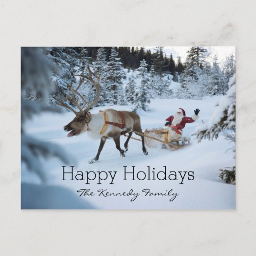 A reindeer pulling Santa Claus and his sleigh Holiday Postcard