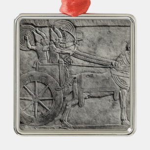 A relief depicting the Assyrian army in battle Metal Ornament