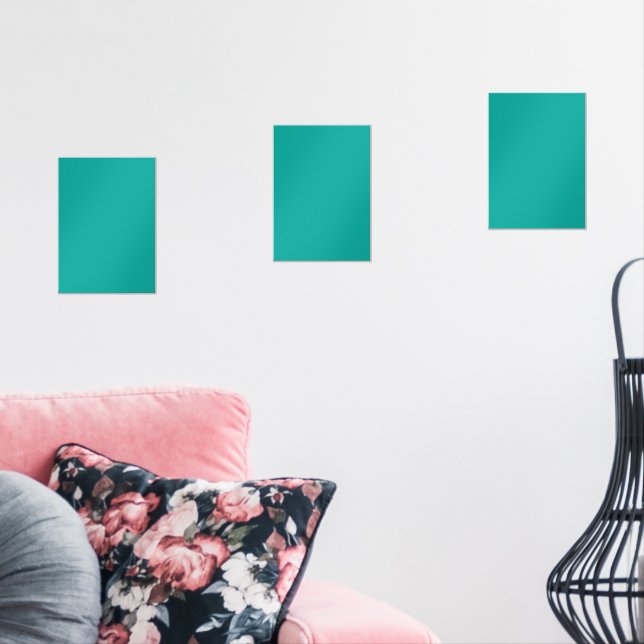 A rich teal green area highlighted by a contrastin wall art sets (Livingroom)