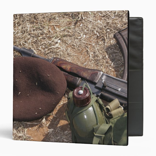 A rifle, military cover and canteen 3 ring binder (Front/Inside)
