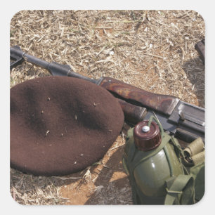 A rifle, military cover and canteen square sticker