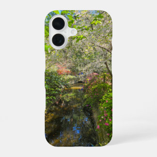 a river in the garden surrounded by flowers iPhone 16 case