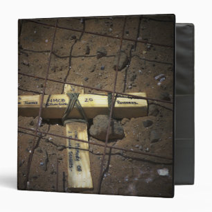 A road repair crew places a cross binder