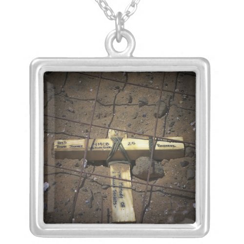 A road repair crew places a cross silver plated necklace