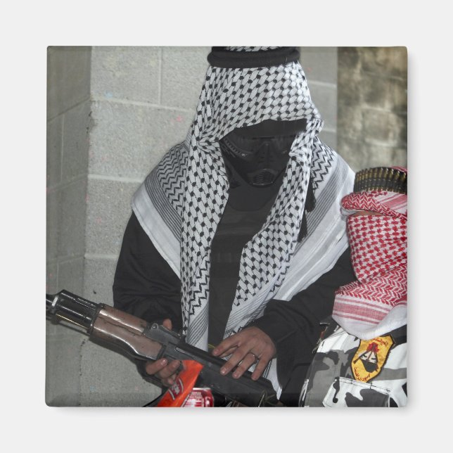 A role-playing enemy aggressor arms a dummy magnet (Front)