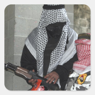 A role-playing enemy aggressor arms a dummy square sticker