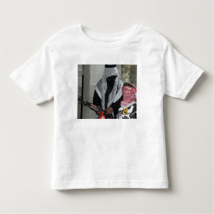 A role-playing enemy aggressor arms a dummy toddler t-shirt