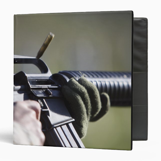 A round flies from the chamber of an M-16A2 Binder (Front/Inside)
