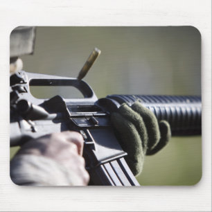 A round flies from the chamber of an M-16A2 Mouse Pad
