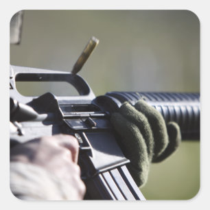 A round flies from the chamber of an M-16A2 Square Sticker