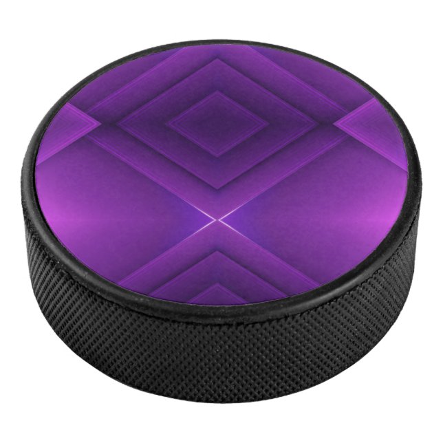 A round purple hockey puck with a geometric (3/4)