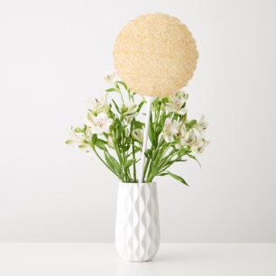 A round rug with a vibrant blend of yellow and ora balloon