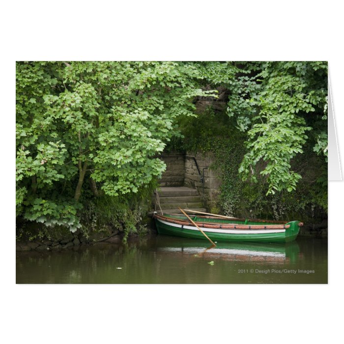 A Row Boat Roped At Some Stairs Along The Shore Cards