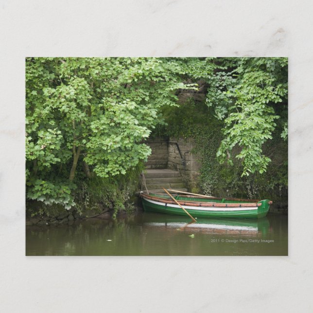 A Row Boat Roped At Some Stairs Along The Shore Postcard (Front)