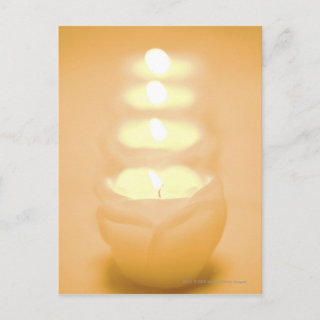 A row of lit candles postcard (Front)