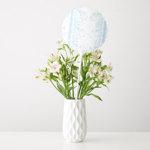 A rug featuring a blue and white creative arts mot balloon