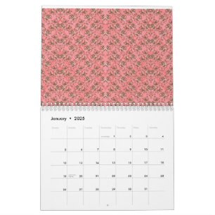A rug with a red and pink motif features a decorat calendar