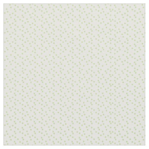 A scattering of pale green squares on white. fabric