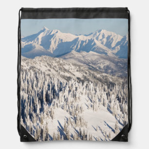 A Scenic View of Snowy Mountains and Trees. Drawstring Bag