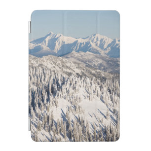 A Scenic View of Snowy Mountains and Trees. iPad Mini Cover