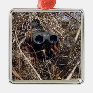 A scout observer practices observation techniqu 2 metal ornament