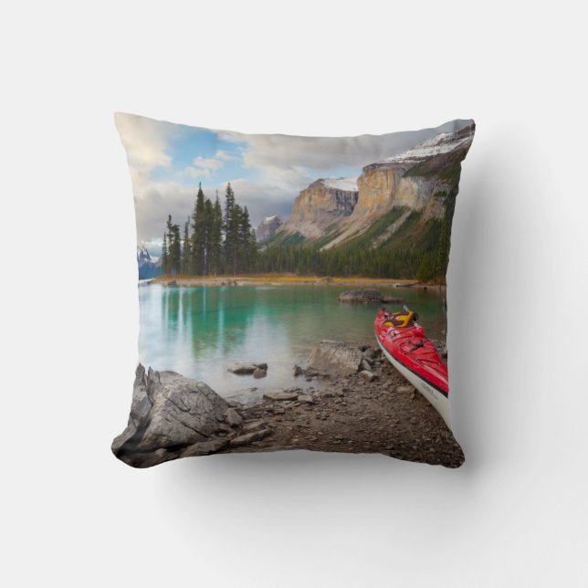 A sea kayak ashore at Spirit Island Throw Pillow (Front)