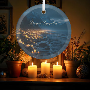 A sea of candlelights on the beach, sympathy glass ornament
