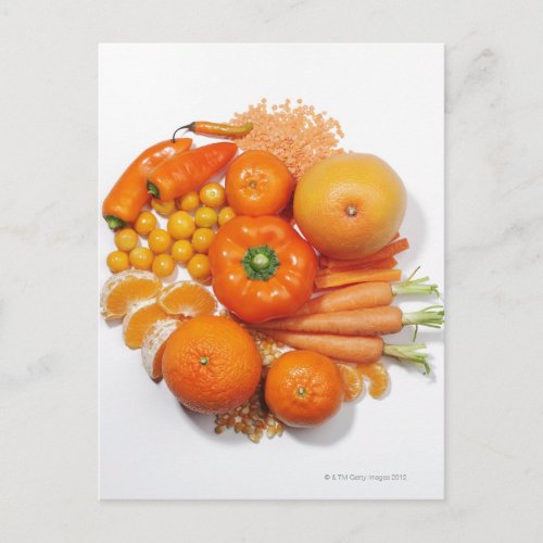 A selection of orange fruits  vegetables postcard