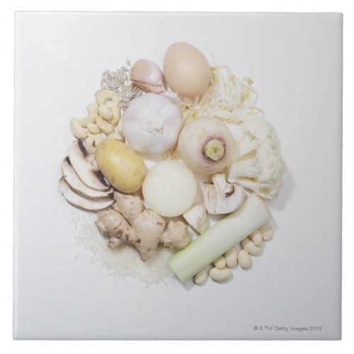 A selection of white fruits  vegetables ceramic tile