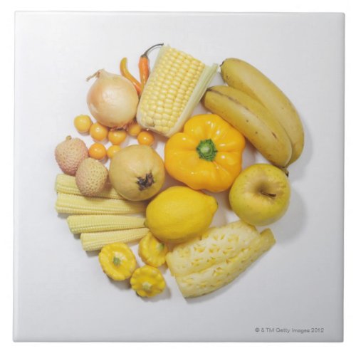 A selection of yellow fruits  vegetables ceramic tile