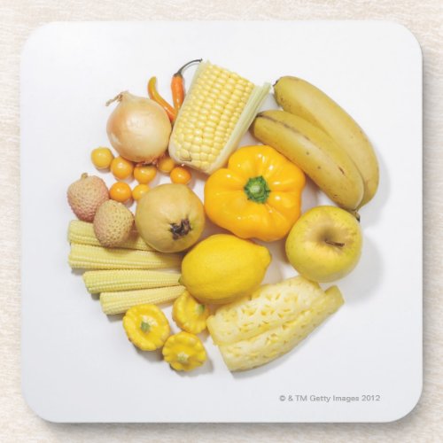 A selection of yellow fruits  vegetables drink coaster