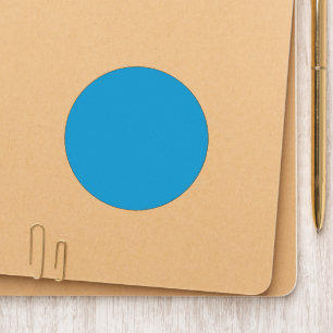 A serene blue sky with a few scattered white cloud patch