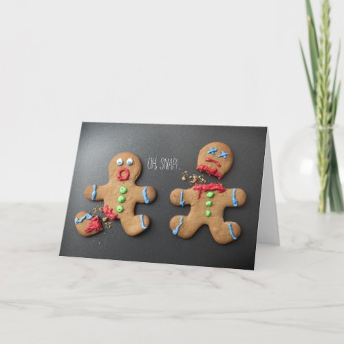 A shocked gingerbread man with broken leg holiday card