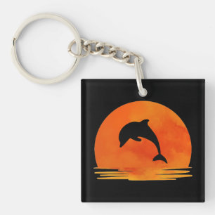 A Silhouette of Jumping Dolphin at Sunset. Keychain
