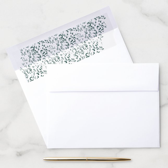 A silver drop splashes into a pool of white liquid envelope liner (Desk)