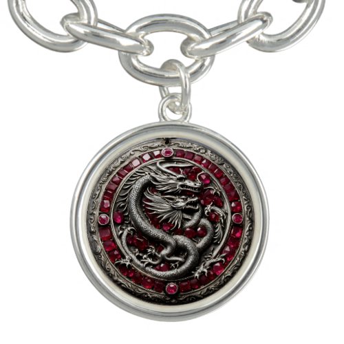 A silver medallion with a silver european dragon a bracelet