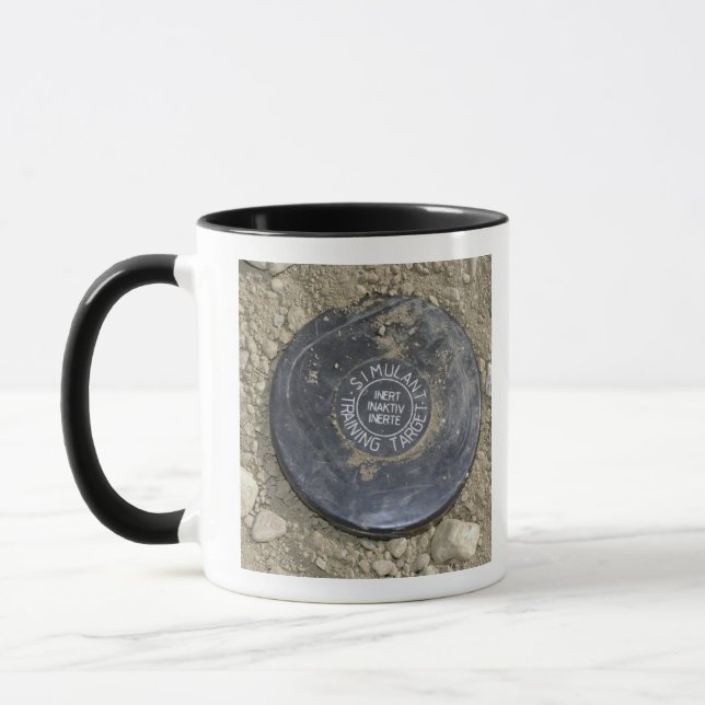A simulated land mine mug (Left)