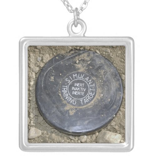 A simulated land mine silver plated necklace
