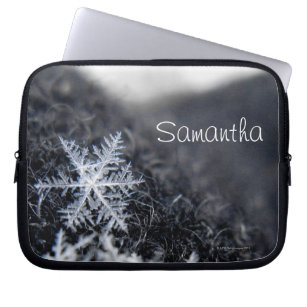 A single snowflake on stands out laptop sleeve