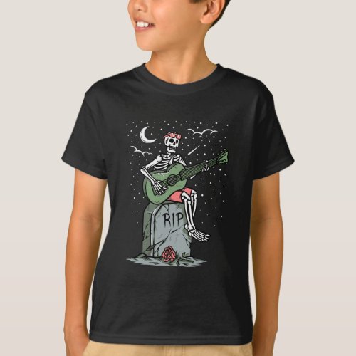 A skeleton playing guitar on a grave T_Shirt