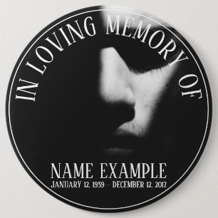 A sleeping face in half shadow button