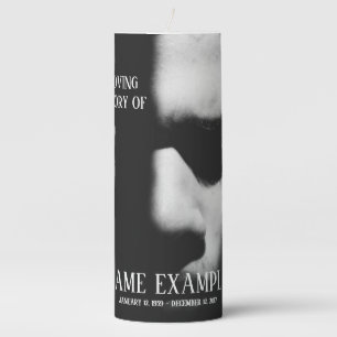 A sleeping face in half shadow pillar candle