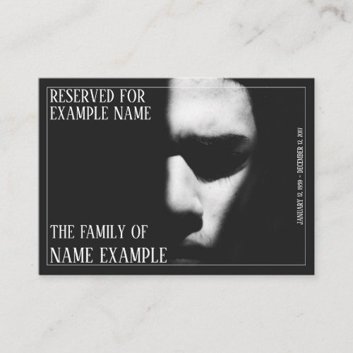 A sleeping face in half shadow place card