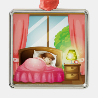 A sleeping girl on a bed metal ornament