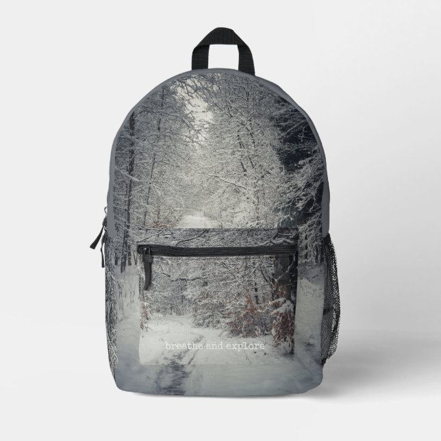 A snow-covered path through a winter forest printed backpack (Front)