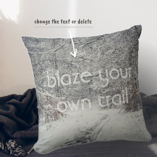 A snow-covered path through a winter forest throw pillow