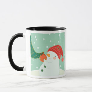 A snowman hanging an ornament on a tree mug