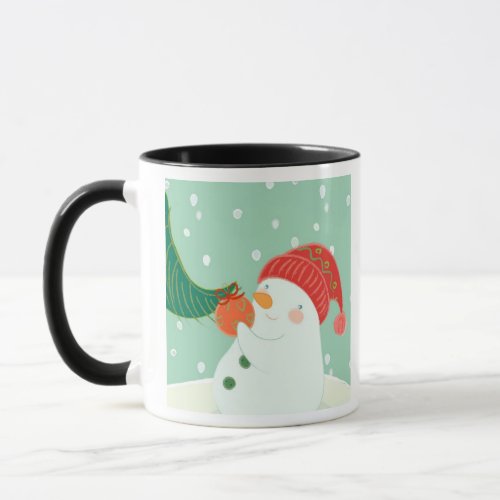 A snowman hanging an ornament on a tree mug