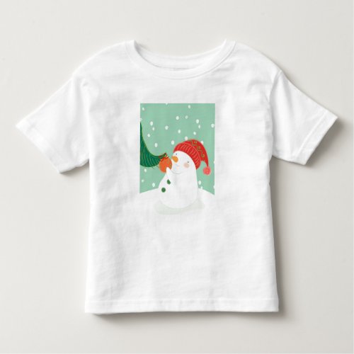 A snowman hanging an ornament on a tree toddler t_shirt